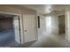Hallway with plush carpet, white walls, and white doors that lead to other rooms in the house at 1414 N Palmsprings Dr, Gilbert, AZ 85234