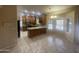 A spacious kitchen features granite countertops, tile backsplash, and a breakfast nook with bright natural light at 1414 N Palmsprings Dr, Gilbert, AZ 85234
