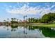 Scenic lake view showcasing the Val Vista Lakes clubhouse and lush greenery, perfect for relaxation at 1414 N Palmsprings Dr, Gilbert, AZ 85234