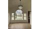 Bright living room with a large window and modern chandelier at 1414 N Palmsprings Dr, Gilbert, AZ 85234