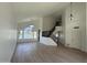 Open-concept living room featuring wood-look floors and staircase at 1414 N Palmsprings Dr, Gilbert, AZ 85234