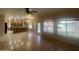 Open-concept living room with hardwood floors, lake view, and adjacent kitchen and dining area at 1414 N Palmsprings Dr, Gilbert, AZ 85234