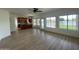 Bright, open living area with hardwood floors and large windows overlooking the lake at 1414 N Palmsprings Dr, Gilbert, AZ 85234