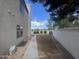 A view of the side yard with a gravel lawn and a house at 1414 N Palmsprings Dr, Gilbert, AZ 85234