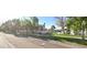 Street view of charming two-story home with landscaped yard and beautiful lake at 1414 N Palmsprings Dr, Gilbert, AZ 85234