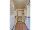 Spacious walk-in closet offering ample shelving, drawers and rod space for all your storage needs at 1414 N Palmsprings Dr, Gilbert, AZ 85234