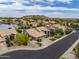 Aerial view of a desert community featuring mature landscaping, and desert views in the background at 15645 S 17Th St, Phoenix, AZ 85048