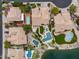 Aerial view of luxury homes showcasing pools, backyard putting greens, and beautifully landscaped yards at 15645 S 17Th St, Phoenix, AZ 85048
