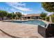 Stunning backyard with a large pool, ample patio space, and views of the home's exterior at 15645 S 17Th St, Phoenix, AZ 85048