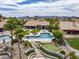This backyard features a pool, hot tub, putting green, covered patio, and mountain views at 15645 S 17Th St, Phoenix, AZ 85048