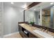 Bathroom featuring double sinks, granite countertops and a decorative mirror at 15645 S 17Th St, Phoenix, AZ 85048