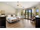 Primary bedroom boasts vaulted ceilings and sliding glass doors to the pool at 15645 S 17Th St, Phoenix, AZ 85048