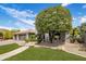 This home features a three-car garage, desert landscaping, and a tile roof at 15645 S 17Th St, Phoenix, AZ 85048