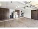 Garage features storage cabinets, appliances, and a clean floor at 15645 S 17Th St, Phoenix, AZ 85048