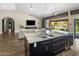 Stylish kitchen with stainless steel appliances, granite countertops, and an open view to the living room at 15645 S 17Th St, Phoenix, AZ 85048