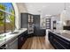 Well-designed kitchen featuring dark cabinetry, stainless steel appliances, and lots of natural light at 15645 S 17Th St, Phoenix, AZ 85048