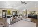 Expansive living space featuring hardwood floors, modern furniture, and a well-equipped kitchen at 15645 S 17Th St, Phoenix, AZ 85048