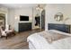 Primary bedroom showcases hardwood floors, furniture, and a walk-in closet at 15645 S 17Th St, Phoenix, AZ 85048