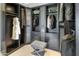 This walk-in closet boasts lots of storage with dark gray cabinets and drawers at 15645 S 17Th St, Phoenix, AZ 85048