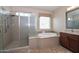 Bathroom featuring a separate shower and soaking tub at 16445 W Berkeley Rd, Goodyear, AZ 85395