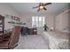 Comfortable bedroom featuring a ceiling fan, a desk, and a comfortable bed at 16445 W Berkeley Rd, Goodyear, AZ 85395