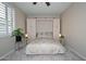 This comfortable bedroom features recessed lights, plush carpet, and a built-in murphy bed at 16445 W Berkeley Rd, Goodyear, AZ 85395