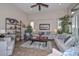 Bright living room featuring tile floors, neutral decor, and an open layout at 16445 W Berkeley Rd, Goodyear, AZ 85395