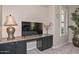 Sitting area with built in desk, large window and plant at 16445 W Berkeley Rd, Goodyear, AZ 85395