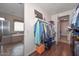 A walk-in closet featuring custom shelving and storage options at 16445 W Berkeley Rd, Goodyear, AZ 85395