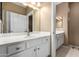 Bright bathroom featuring white cabinetry, large vanity, and modern sink fixtures at 16626 E Westby Dr # 108, Fountain Hills, AZ 85268