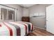 Bedroom with wood-look floors and a comfortable-looking bed and neutral walls at 16626 E Westby Dr # 108, Fountain Hills, AZ 85268