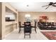 Dining area with stylish table and chairs, adjacent to living room and kitchen at 16626 E Westby Dr # 108, Fountain Hills, AZ 85268