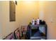 Storage area with assorted cleaning products, shelves, and an electrical panel at 16626 E Westby Dr # 108, Fountain Hills, AZ 85268