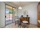 Cozy dining area with access to the patio and complemented by a stylish buffet at 17640 W Babbitt Dr, Surprise, AZ 85374
