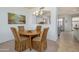 Cozy dining area featuring a round table and seamless transition to kitchen at 17640 W Babbitt Dr, Surprise, AZ 85374