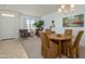 Bright dining area featuring a wood table and ample natural light at 17640 W Babbitt Dr, Surprise, AZ 85374