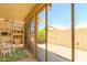 Enclosed patio with screened windows providing outdoor views with an exterior seating area at 17640 W Babbitt Dr, Surprise, AZ 85374