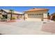 Beautiful home exterior with a well-maintained lawn, desert landscaping, and a two-car garage on a sunny day at 17640 W Babbitt Dr, Surprise, AZ 85374