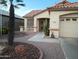 Inviting single-story home showcasing desert landscaping with a decorative walkway at 17640 W Babbitt Dr, Surprise, AZ 85374