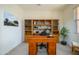 Dedicated home office space with built-in bookshelves and a comfortable workspace at 17640 W Babbitt Dr, Surprise, AZ 85374