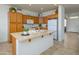 Bright kitchen with ample cabinet space, an island, and modern appliances at 17640 W Babbitt Dr, Surprise, AZ 85374