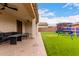 A large backyard that features outdoor seating and a play area offering space for relaxation and activities at 17652 W Straight Arrow Ln, Surprise, AZ 85387