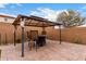 This backyard gazebo has outdoor seating and barstools, creating an inviting space for relaxation and socializing at 17652 W Straight Arrow Ln, Surprise, AZ 85387