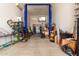 Spacious garage featuring a car lift and various storage items at 17652 W Straight Arrow Ln, Surprise, AZ 85387