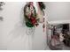 Close up of a stairway hallway showcasing decorations, a seasonal wreath, and ample storage space at 17652 W Straight Arrow Ln, Surprise, AZ 85387