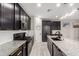 Well-equipped kitchen featuring stainless steel appliances and granite countertops at 17652 W Straight Arrow Ln, Surprise, AZ 85387