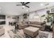 Inviting living room featuring a comfortable sectional sofa and stylish decor at 17652 W Straight Arrow Ln, Surprise, AZ 85387
