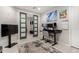 Stylish home office featuring sliding doors, monitors, and an inviting workspace at 17652 W Straight Arrow Ln, Surprise, AZ 85387