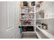 Organized pantry with ample shelving and storage for all your kitchen essentials at 17652 W Straight Arrow Ln, Surprise, AZ 85387