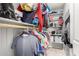 Bright walk-in closet featuring shelving and hanging storage for clothes and accessories at 17652 W Straight Arrow Ln, Surprise, AZ 85387